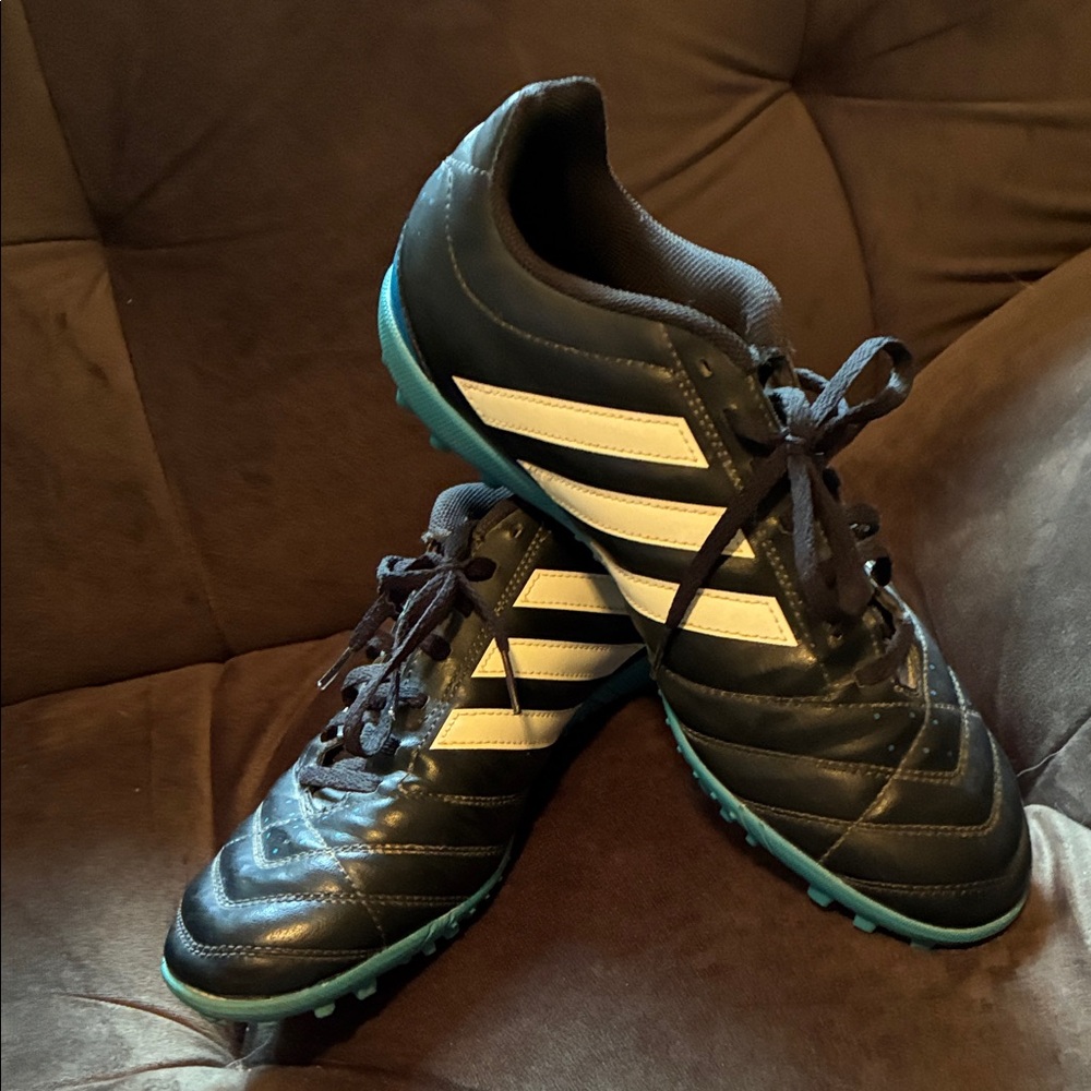 adidas Men’s Black Athletic Cleats with White Stripes and Blue Sole